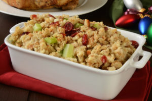 A bowl of cranberry stuffing with vegetables